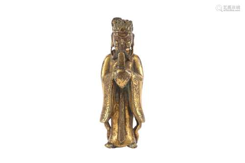 A CHINESE GILT-BRONZE FIGURE OF AN OFFICIAL.