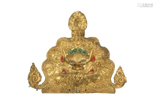 A TIBETAN GILT-COPPER 'KIRTIMUKHA' PLAQUE.