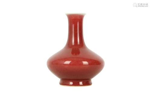 A CHINESE COPPER RED-GLAZED BOTTLE VASE.