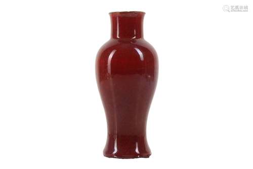 A CHINESE COPPER RED-GLAZED BALUSTER VASE.