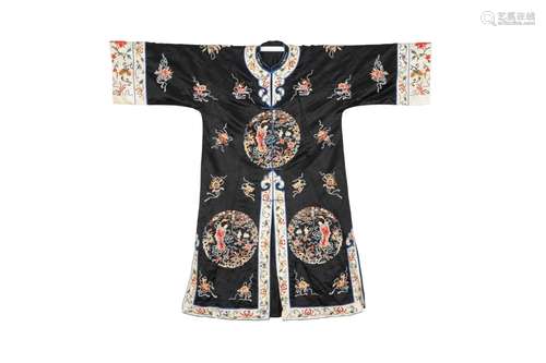 A CHINESE EMBROIDERED BLACK-GROUND SILK ROBE.