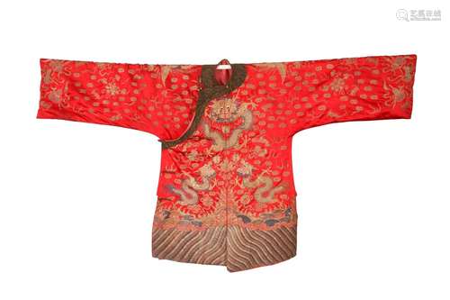 A CHINESE EMBROIDERED RED-GROUND SILK 'DRAGON AND PHOEN...