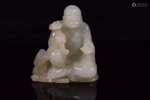 CREAMY JADE CARVING OF A SEATED ARHAT