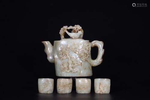 A SET OF JADE CARVING RELIEFED TEAPOT AND CUPS