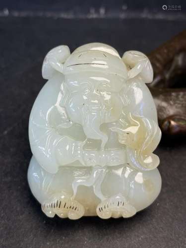 CHINESE JADE CARVING OF A SEATED FIGURE