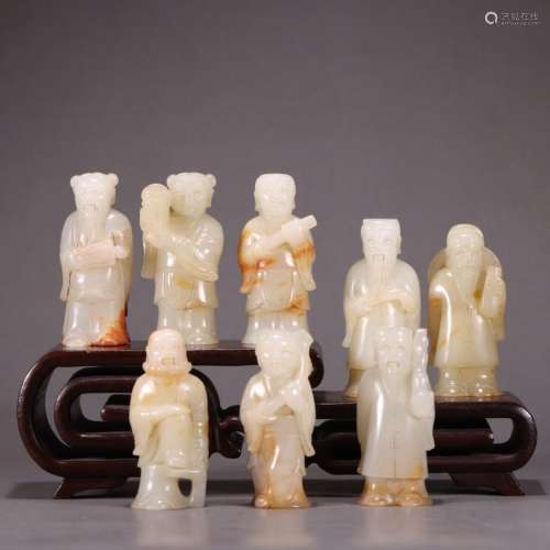 A SET OF RUSSET JADE CARVED FIGURINES OF IMMORTALS