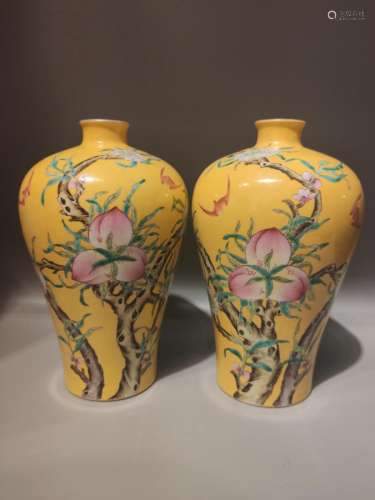 PAIR OF YELLOW GROUND FAMILLE ROSE MEIPING VASES