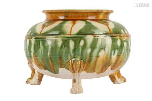 A CHINESE SANCAI-GLAZED GREEN-SPLASHED POTTERY TRIPOD CENSER...