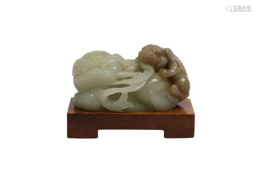 A CHINESE PALE CELADON JADE 'LION DOGS' GROUP.