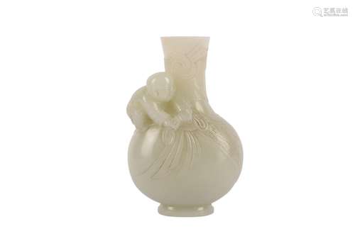 A CHINESE PALE CELADON JADE MINIATURE VASE.