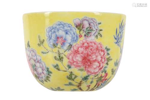 A CHINESE FAMILLE ROSE YELLOW-GROUND 'PEONIES' CUP...