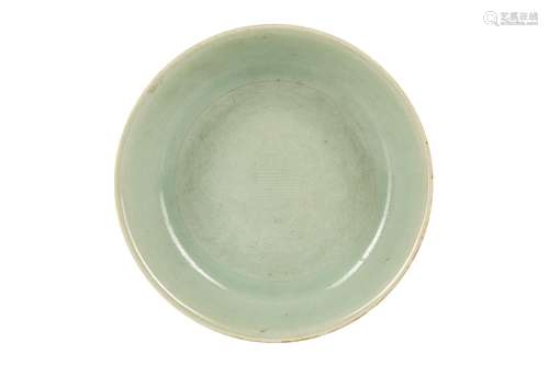 A CHINESE INCISED CELADON 'DRAGONS' DISH.