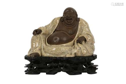 A CHINESE SHIWAN FIGURE OF BUDAI HESHAN.