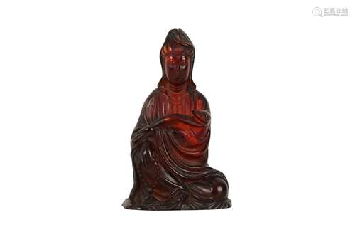 A CHINESE RECOMPOSITED AMBER FIGURE OF GUANYIN.