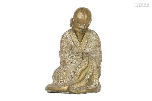 A CHINESE BRONZE FIGURE OF A LUOHAN.