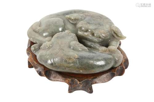 A CHINESE CELADON JADE CARVING OF TWO LION DOGS.