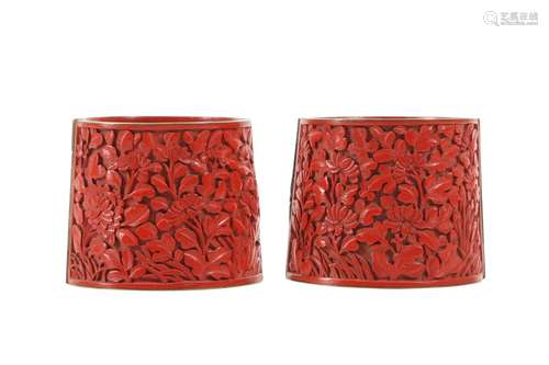 A PAIR OF CHINESE CINNABAR RED LACQUER WRIST BANDS.