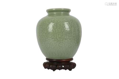 A CHINESE CELADON-GLAZED 'DRAGON' JAR.