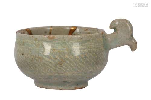 A SMALL KOREAN CELADON HANDLED BOWL.