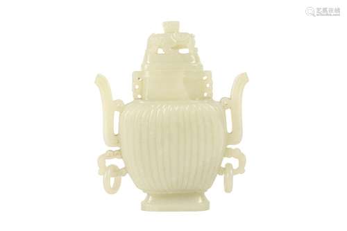 A CHINESE PALE CELADON JADE VASE AND COVER.