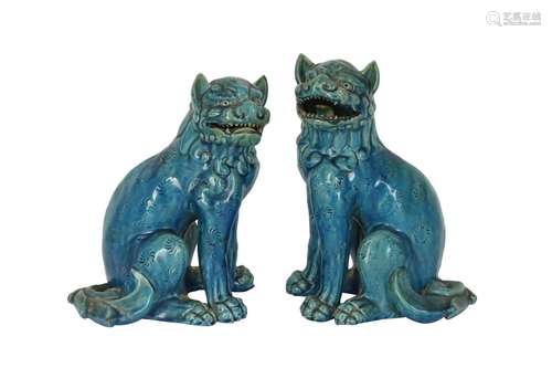 A NEAR-PAIR OF JAPANESE TURQUOISE-GLAZED LION DOGS.