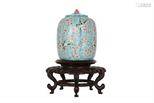 A CHINESE FAMILLE ROSE 'PRUNUS AND MAGPIES' JAR AN...