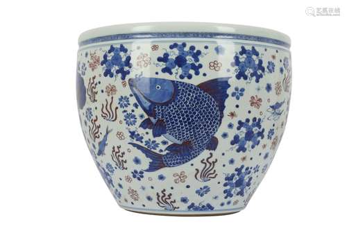 A LARGE CHINESE BLUE AND WHITE AND RED FISHBOWL.