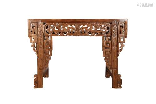 A CHINESE CARVED WOOD TABLE.