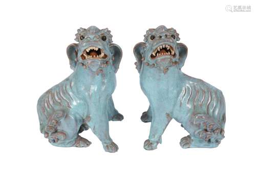 A PAIR OF CHINESE TURQUOISE-GLAZED LION DOGS.