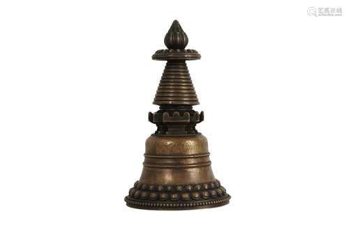 A TIBETAN BRONZE STUPA.