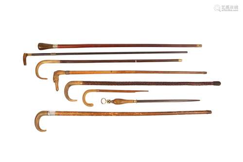 λ EIGHT WALKING STICKS AND CANES WITH RHINOCEROS HORN HANDLE...