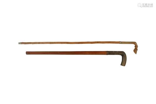 λ TWO WALKING STICKS WITH RHINOCEROS HORN HANDLES.