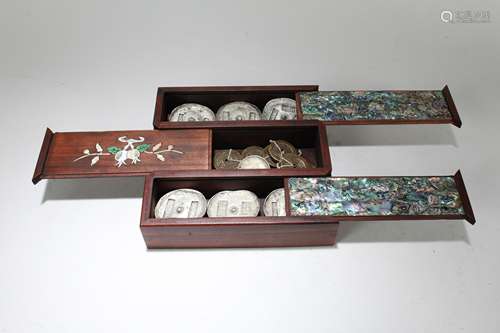 A Chinese Lidded Coin-filled Wooden Box