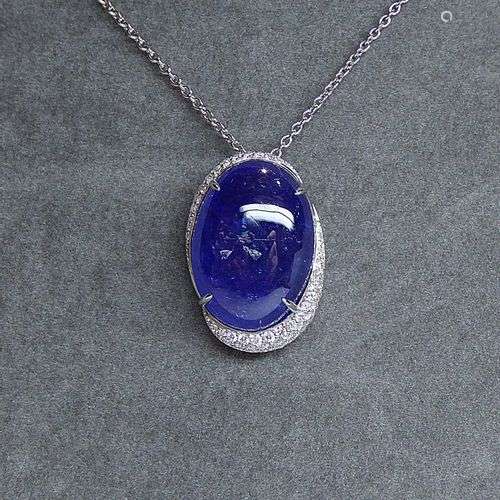 Pendentif or blanc soutenant une importante Tanzanite ovale ...