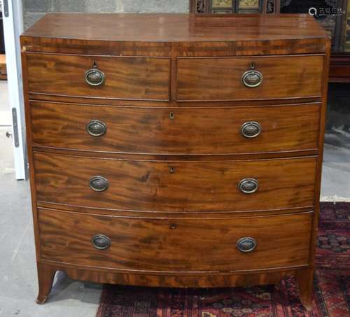 A GEORGE III BOW FRONTED VENEERED FIVE DRAWER CHEST OF