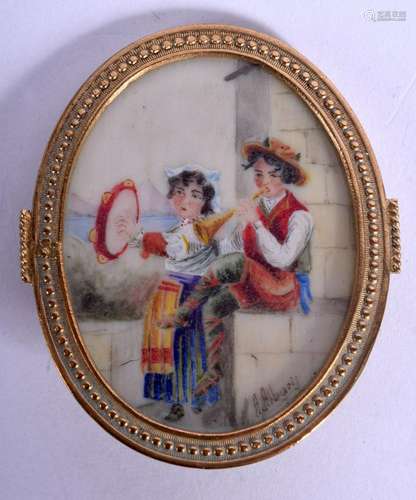 AN ANTIQUE PAINTED IVORY BROOCH depicting two gypsies