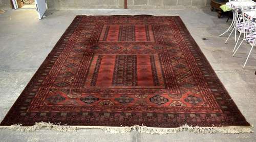 A LARGE BELGIUM WOOLEN RED GROUND CARPET, with blue and