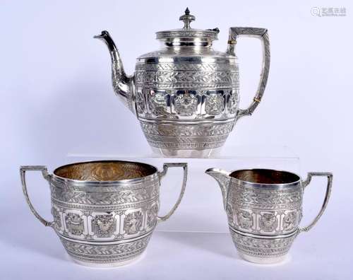 AN ANTIQUE INDIAN THREE PIECE SILVER TEASET decorated