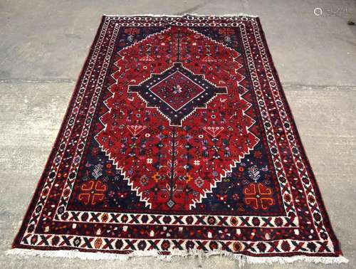 AN EASTERN RED GROUND CARPET, decorated with animals