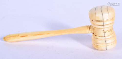 A VICTORIAN CARVED IVORY GAVEL. 14 cm long.