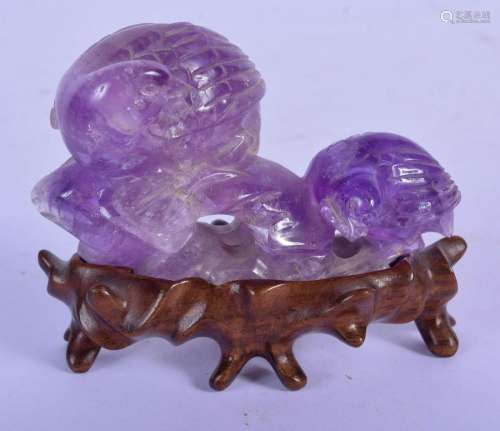 A LATE 19TH CENTURY CHINESE CARVED AMETHYST FIGUR…