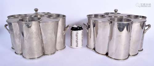 A PAIR OF 1970S SILVER PLATED BOTTLE HOLDERS in the art