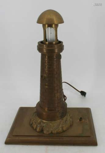 A Large Brass Machined Lighthouse Table Lamp