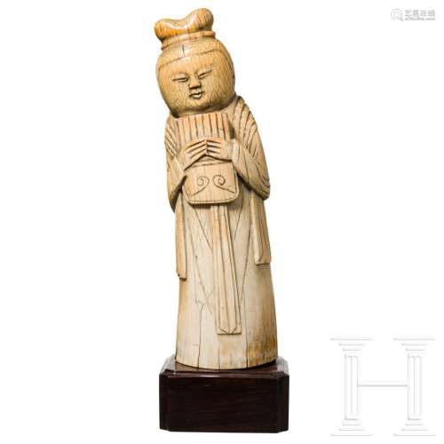 A Ming ivory statuette of a woman with a flute