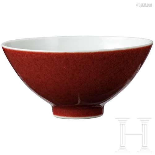 A copper-red glazed cup with 