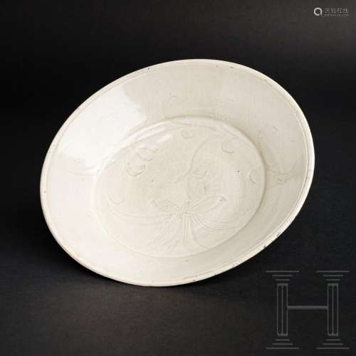 A fine carved 'Lotus' hexafoil Ding bowl, northern Song