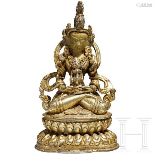 A gilded Tibetan bronze statue of Amithabha with an
