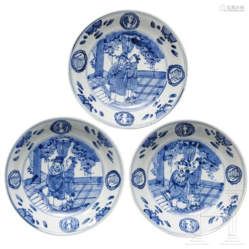 Three blue and white dishes with 