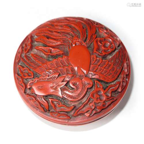 A CARVED CINNABAR LACQUER PHOENIX BOX