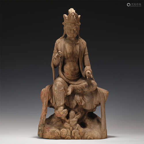 A CARVED WOODEN SEATED GUANYIN